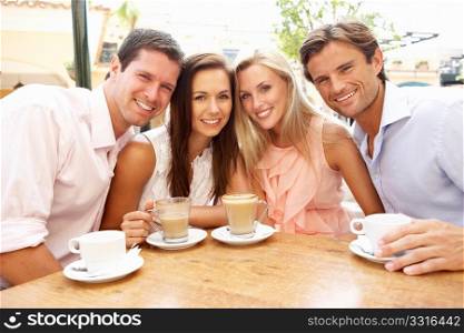 Group Of FriendsEnjoying Coffee In CafZ