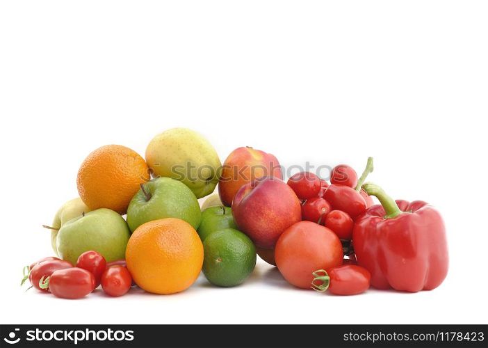 group of fruits and tomatoes on white background