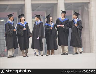 Group of Graduate Students Standing with Diplomas