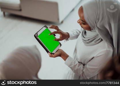 Group of happy African students having a conversation and team meeting working together on homework girls wearing traditional Sudan Muslim hijab fashion. High-quality photo. Group of happy african students having conversation and team meeting working together on homework girls wearing traidiional sudan muslim hijab fashion