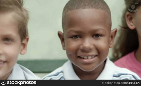 Group of happy children smiling and looking at camera