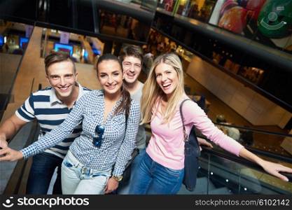 group of happy friends in shopping mall have fun