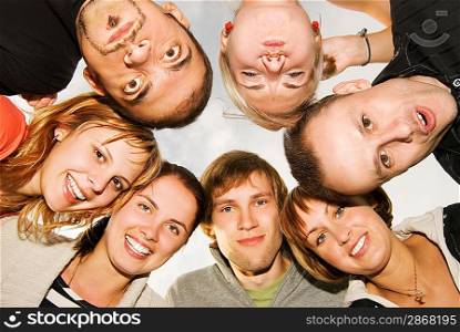 Group of happy friends making funny faces
