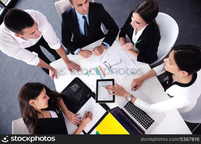 Group of happy young business people in a meeting at office