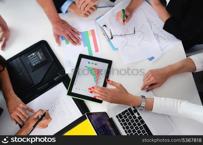 Group of happy young business people in a meeting at office