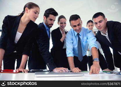 Group of happy young business people in a meeting at office