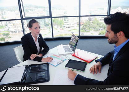 Group of happy young business people in a meeting at office