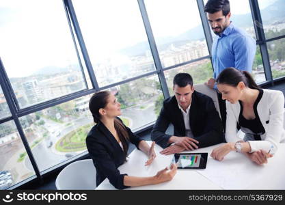 Group of happy young business people in a meeting at office