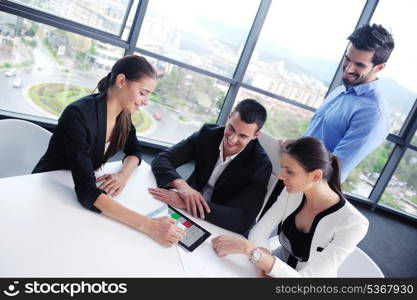 Group of happy young business people in a meeting at office