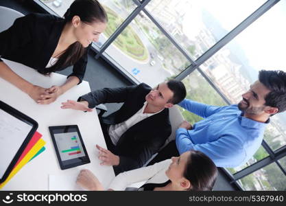 Group of happy young business people in a meeting at office