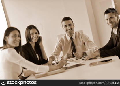 Group of happy young business people in a meeting at office