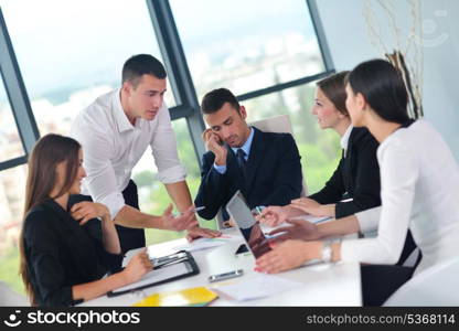 Group of happy young business people in a meeting at office