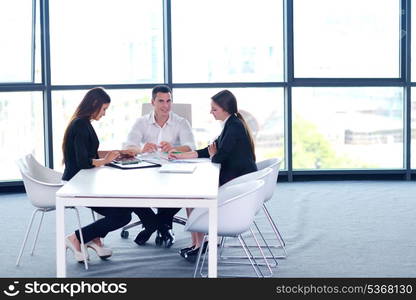 Group of happy young business people in a meeting at office