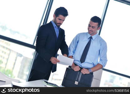 Group of happy young business people in a meeting at office