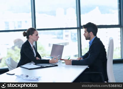 Group of happy young business people in a meeting at office