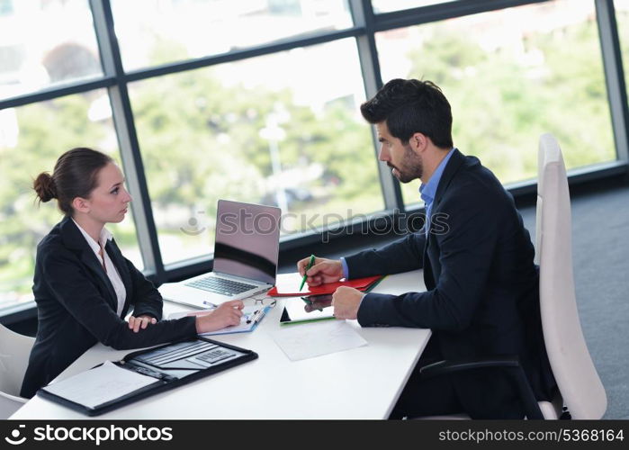 Group of happy young business people in a meeting at office