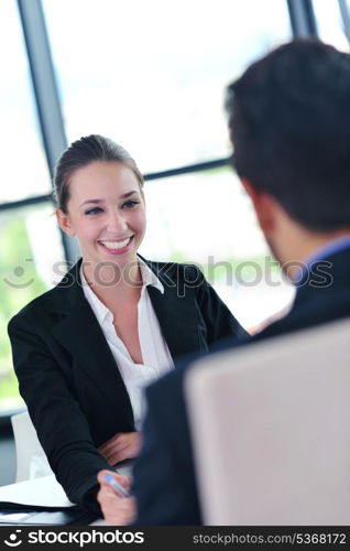 Group of happy young business people in a meeting at office