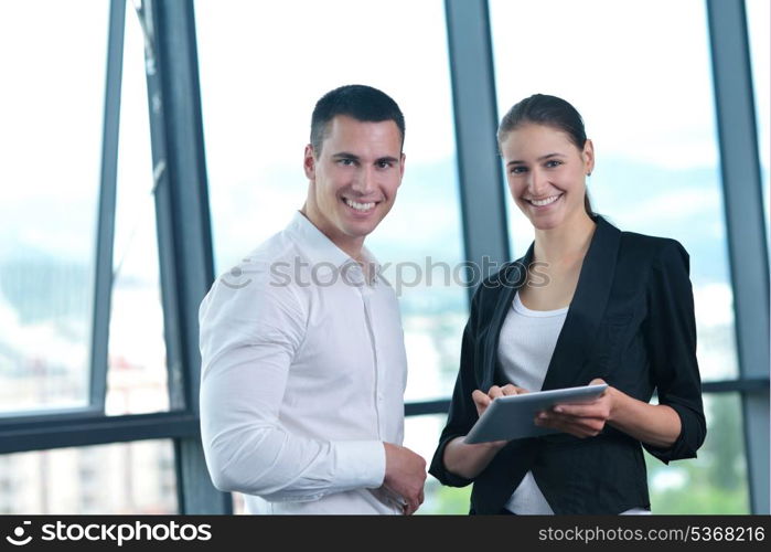 Group of happy young business people in a meeting at office