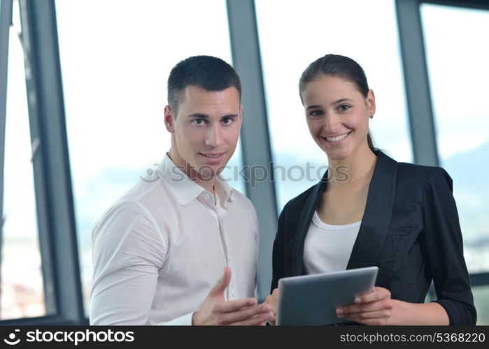 Group of happy young business people in a meeting at office