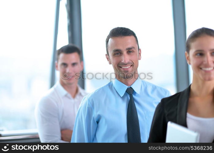 Group of happy young business people in a meeting at office