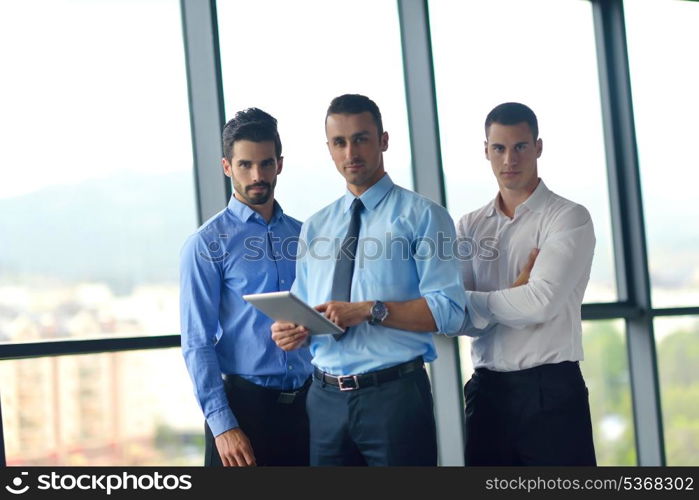 Group of happy young business people in a meeting at office