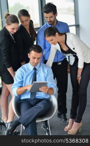 Group of happy young business people in a meeting at office