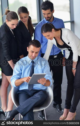 Group of happy young business people in a meeting at office