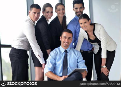 Group of happy young business people in a meeting at office