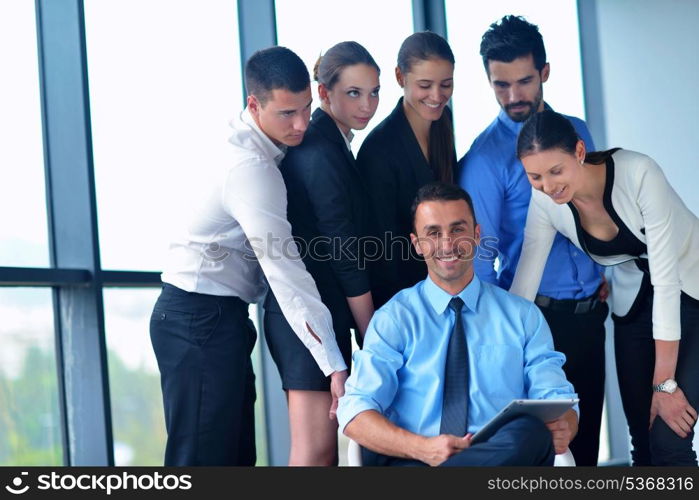 Group of happy young business people in a meeting at office