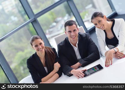 Group of happy young business people in a meeting at office