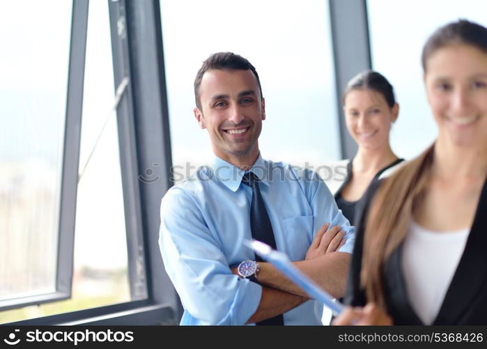 Group of happy young business people in a meeting at office