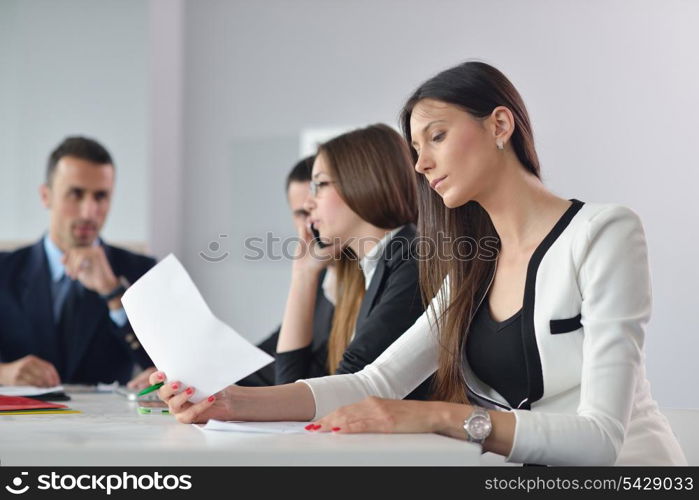 Group of happy young business people in a meeting at office