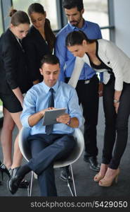 Group of happy young business people in a meeting at office