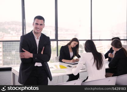 Group of happy young business people in a meeting at office