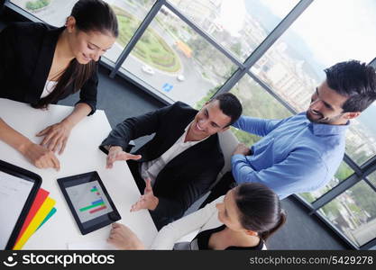 Group of happy young business people in a meeting at office