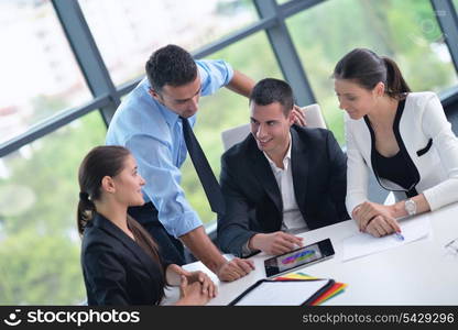 Group of happy young business people in a meeting at office