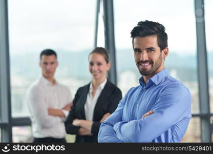 Group of happy young business people in a meeting at office