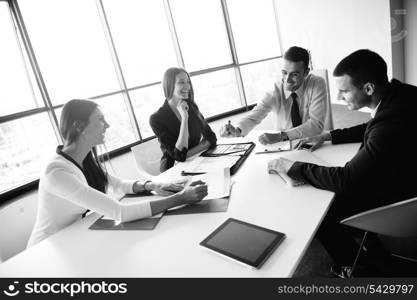 Group of happy young business people in a meeting at office