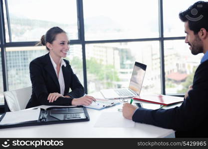 Group of happy young business people in a meeting at office