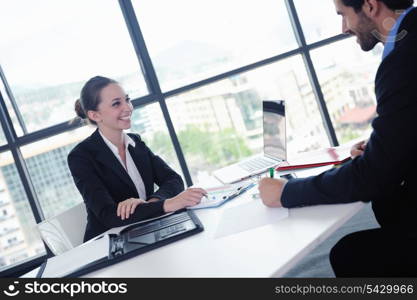 Group of happy young business people in a meeting at office