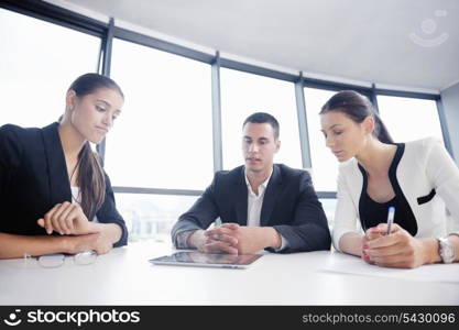 Group of happy young business people in a meeting at office