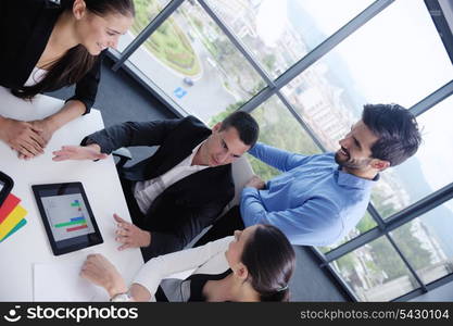 Group of happy young business people in a meeting at office