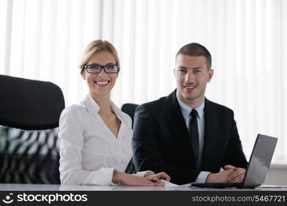 Group of happy young business people in a meeting at office