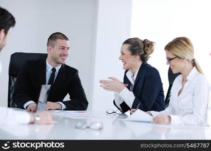 Group of happy young business people in a meeting at office