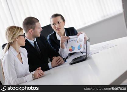 Group of happy young business people in a meeting at office