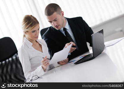 Group of happy young business people in a meeting at office