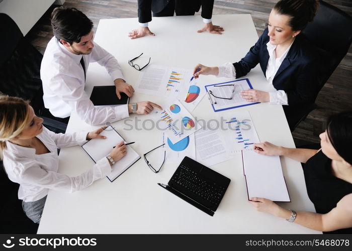 Group of happy young business people in a meeting at office