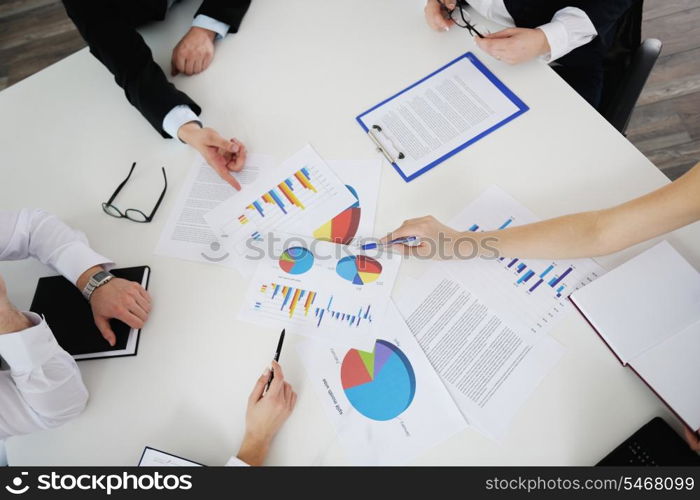 Group of happy young business people in a meeting at office