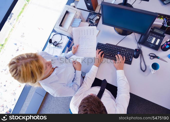 Group of happy young business people in a meeting at office