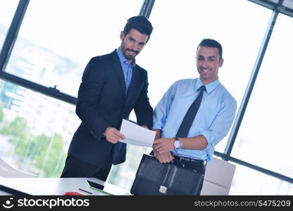 Group of happy young business people in a meeting at office